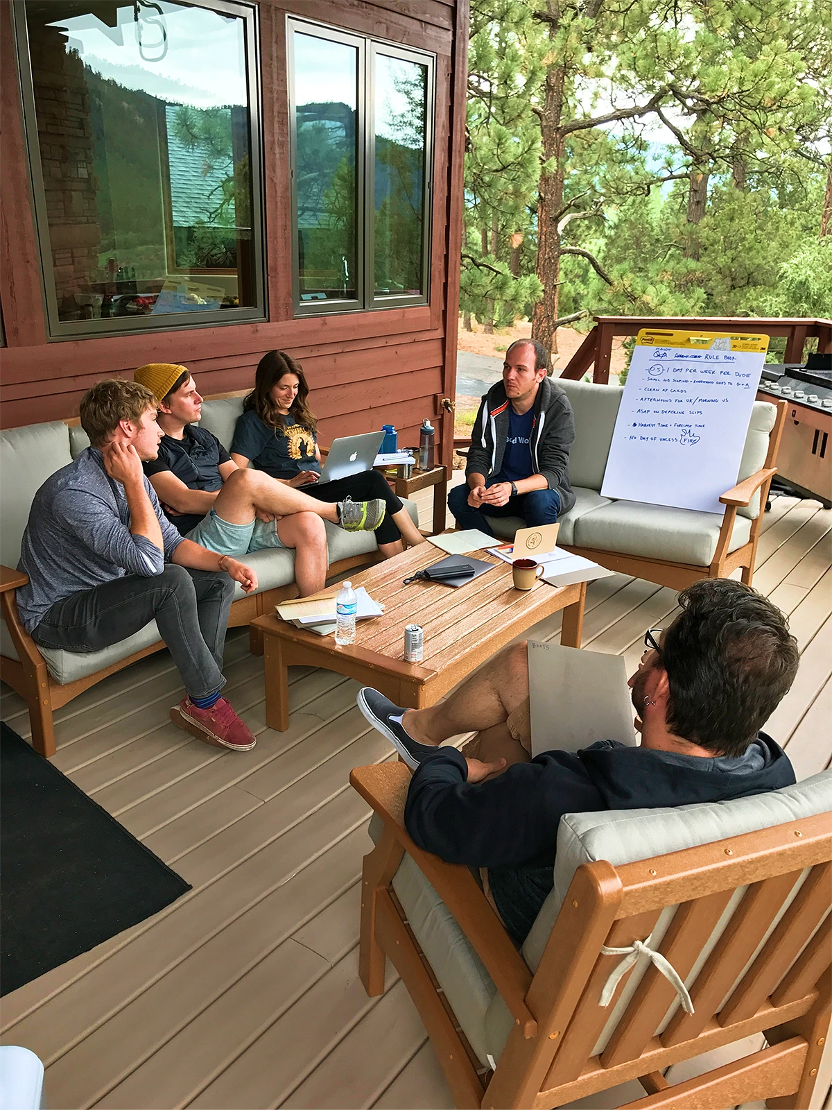 Photo of the Good Work team chatting about their development process outside